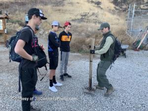 Volunteers Brandon Altbush, Jack van Der Brug and Jacob Stutz of  the El Camino Real charter high school mountain bike team get their McLeods from COSCA ranger Nick. Photo: Jill Connelly